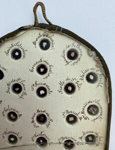 Antique French reliquary with 58 different relics behind glass