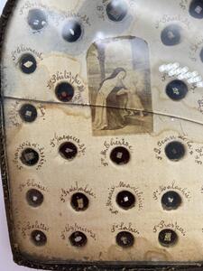 Antique French reliquary with 58 different relics behind glass