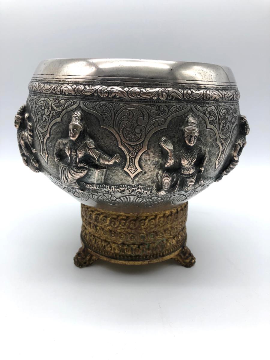 A repousse silver bowl by a peacock maker Burma ca 1900