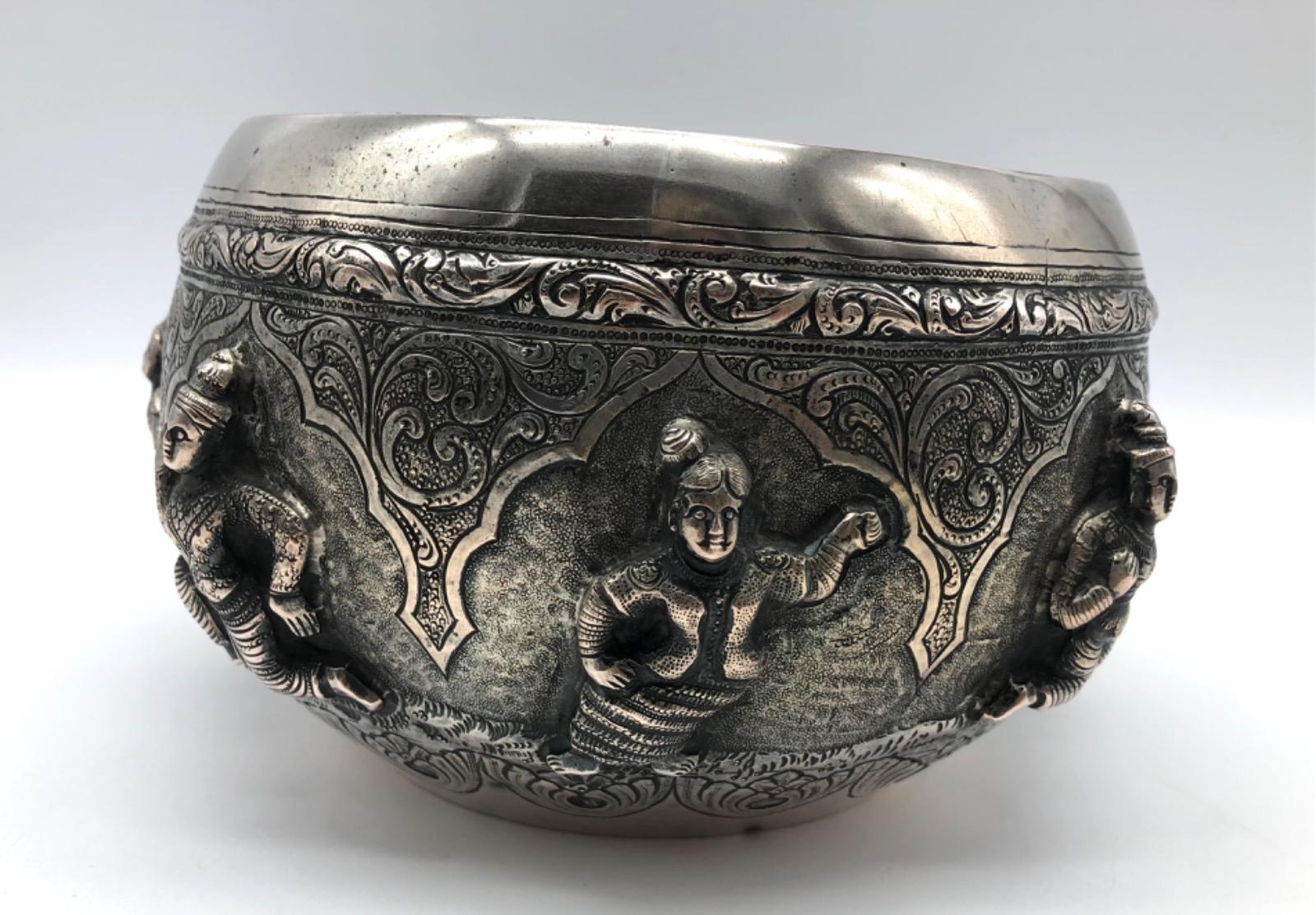 A repousse silver bowl by a peacock maker Burma ca 1900
