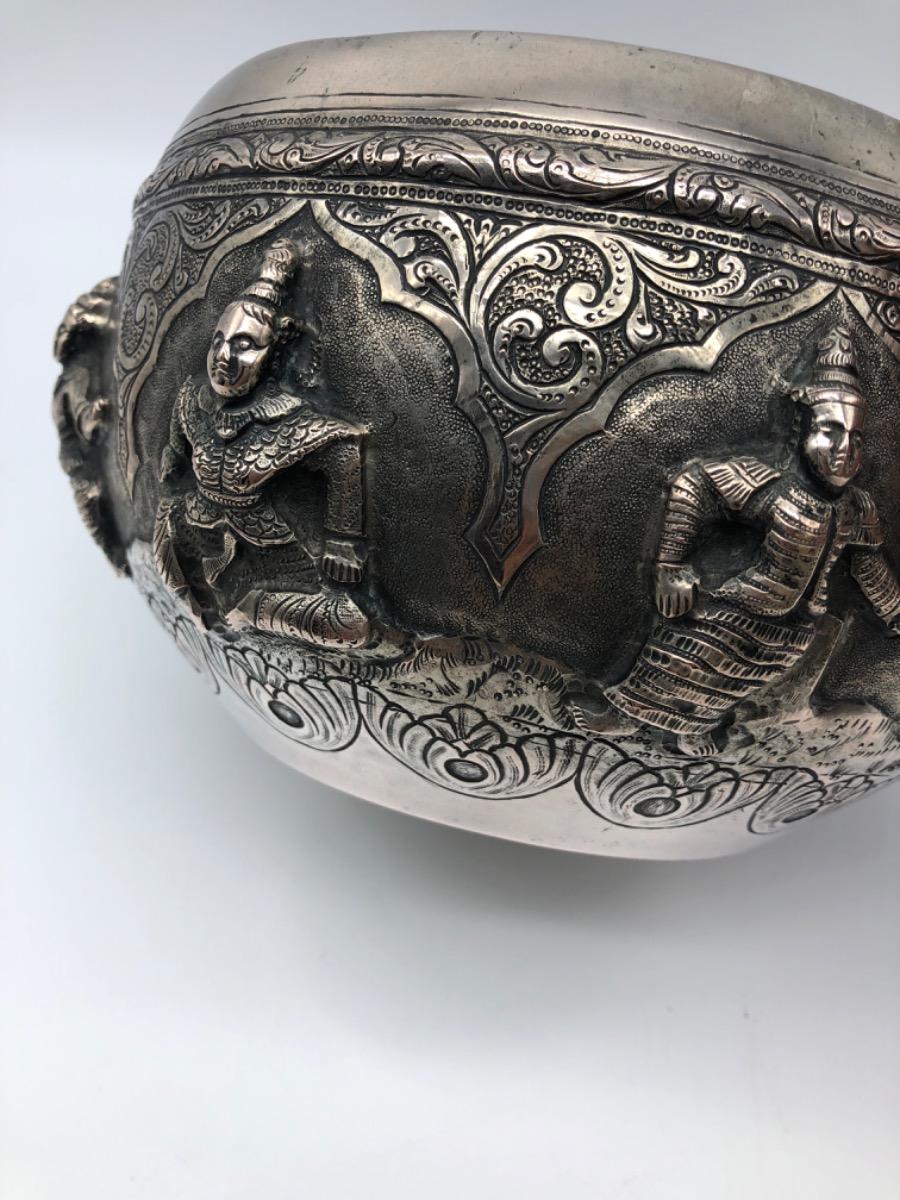 A repousse silver bowl by a peacock maker Burma ca 1900