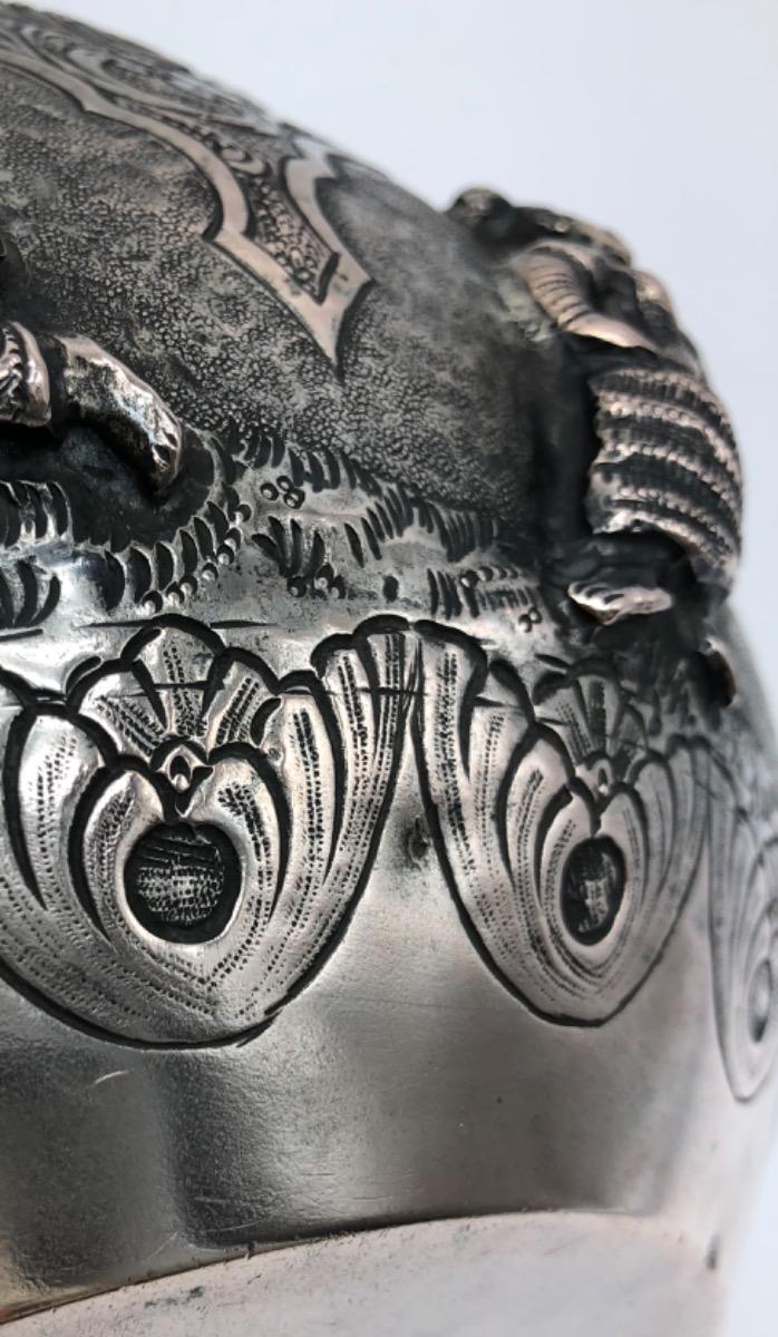 A repousse silver bowl by a peacock maker Burma ca 1900