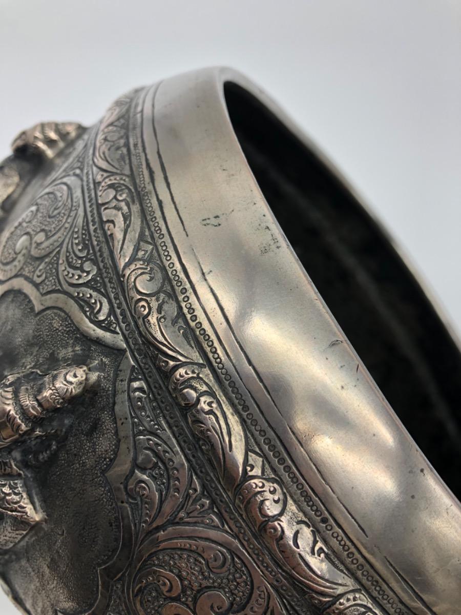 A repousse silver bowl by a peacock maker Burma ca 1900