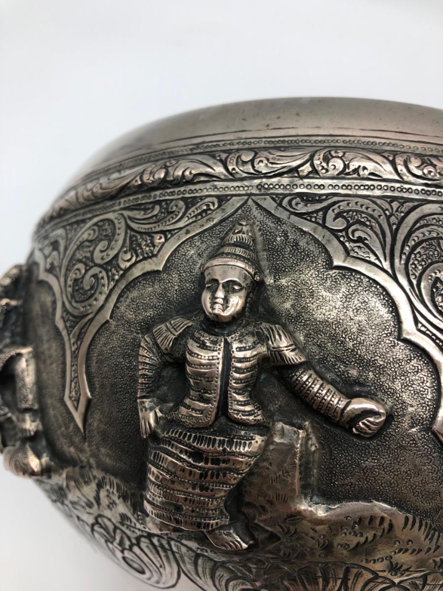 A repousse silver bowl by a peacock maker Burma ca 1900