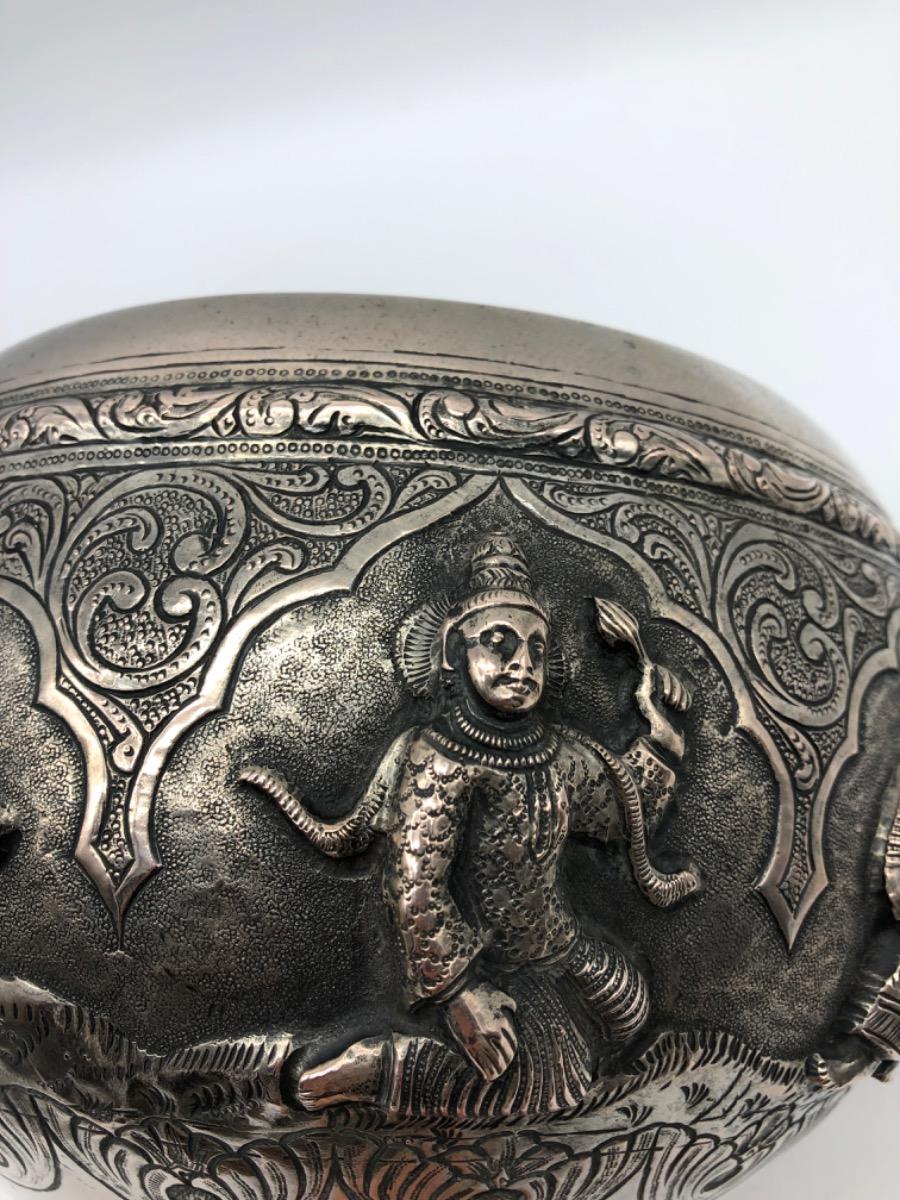 A repousse silver bowl by a peacock maker Burma ca 1900