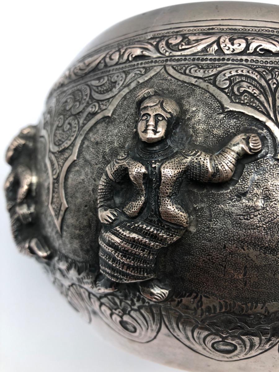A repousse silver bowl by a peacock maker Burma ca 1900