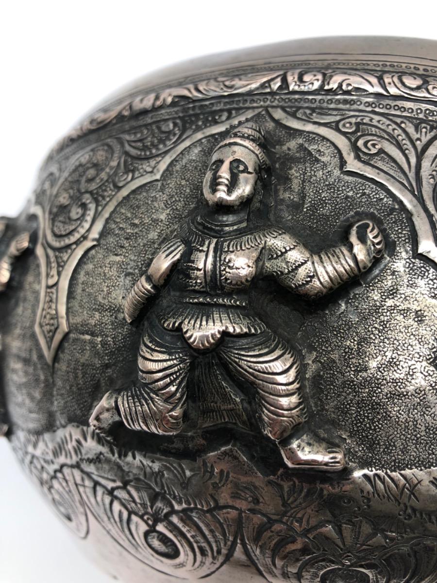 A repousse silver bowl by a peacock maker Burma ca 1900