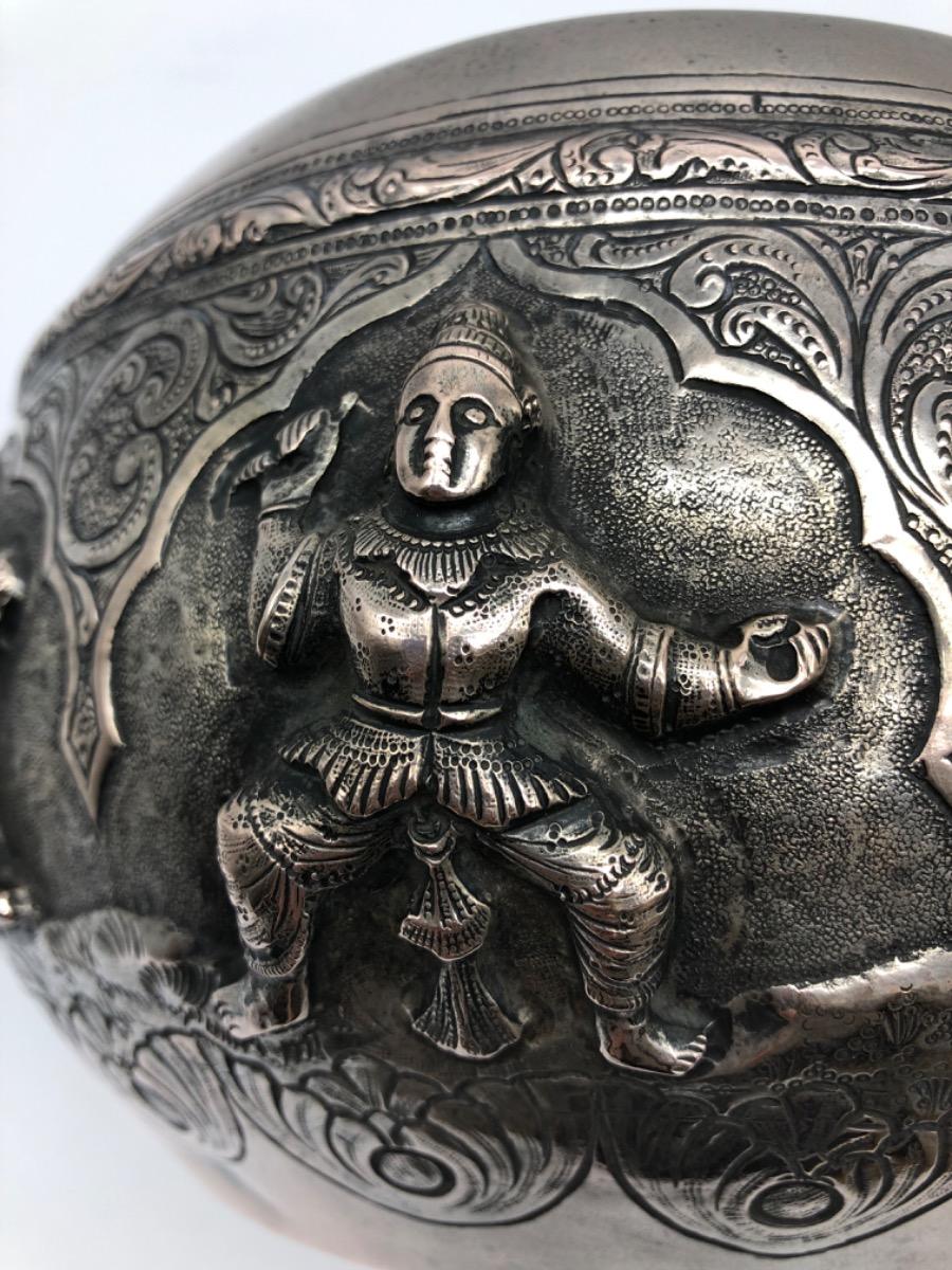 A repousse silver bowl by a peacock maker Burma ca 1900