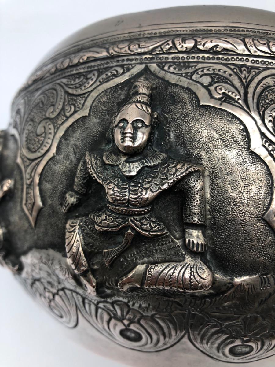 A repousse silver bowl by a peacock maker Burma ca 1900