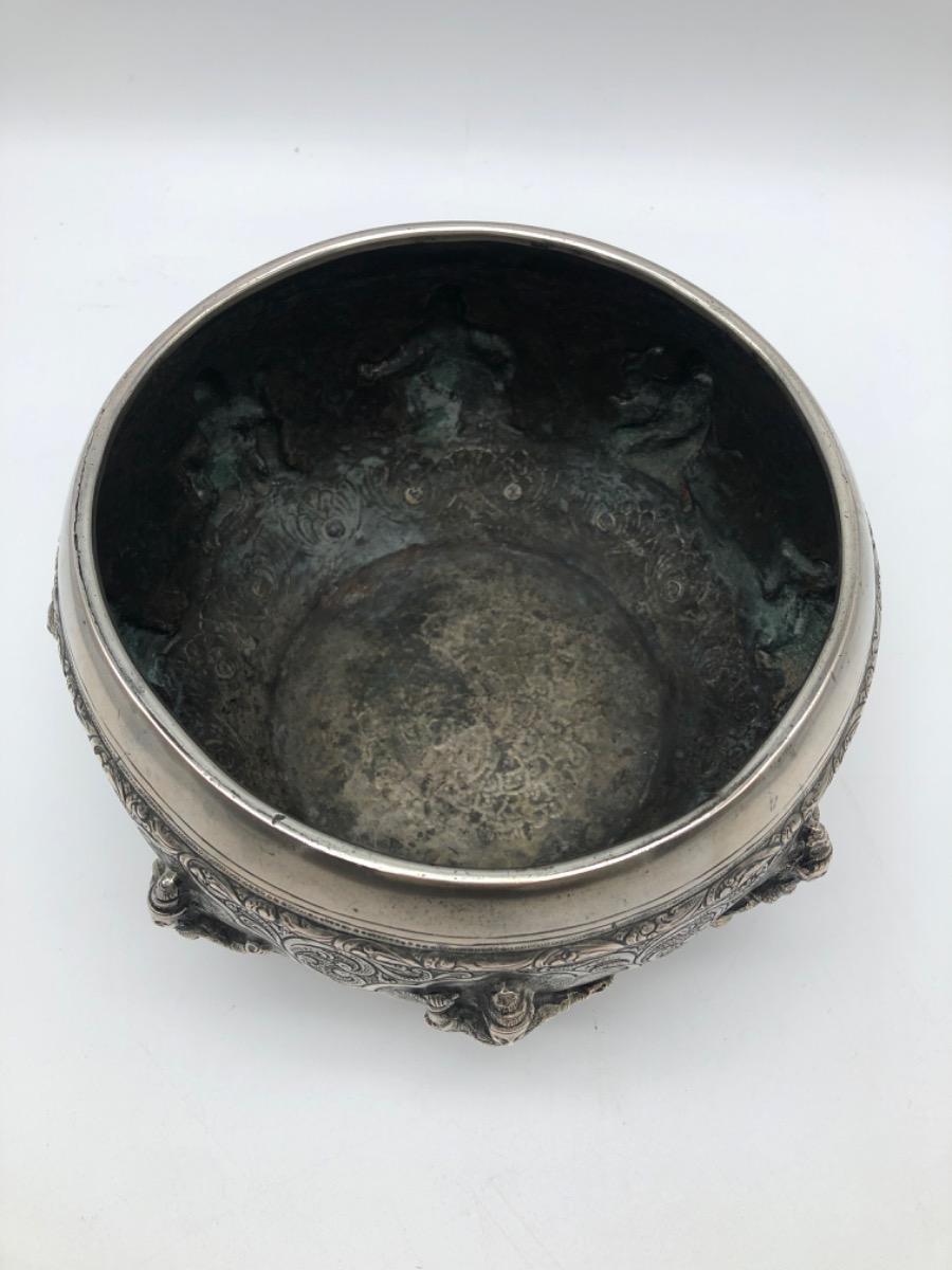 A repousse silver bowl by a peacock maker Burma ca 1900