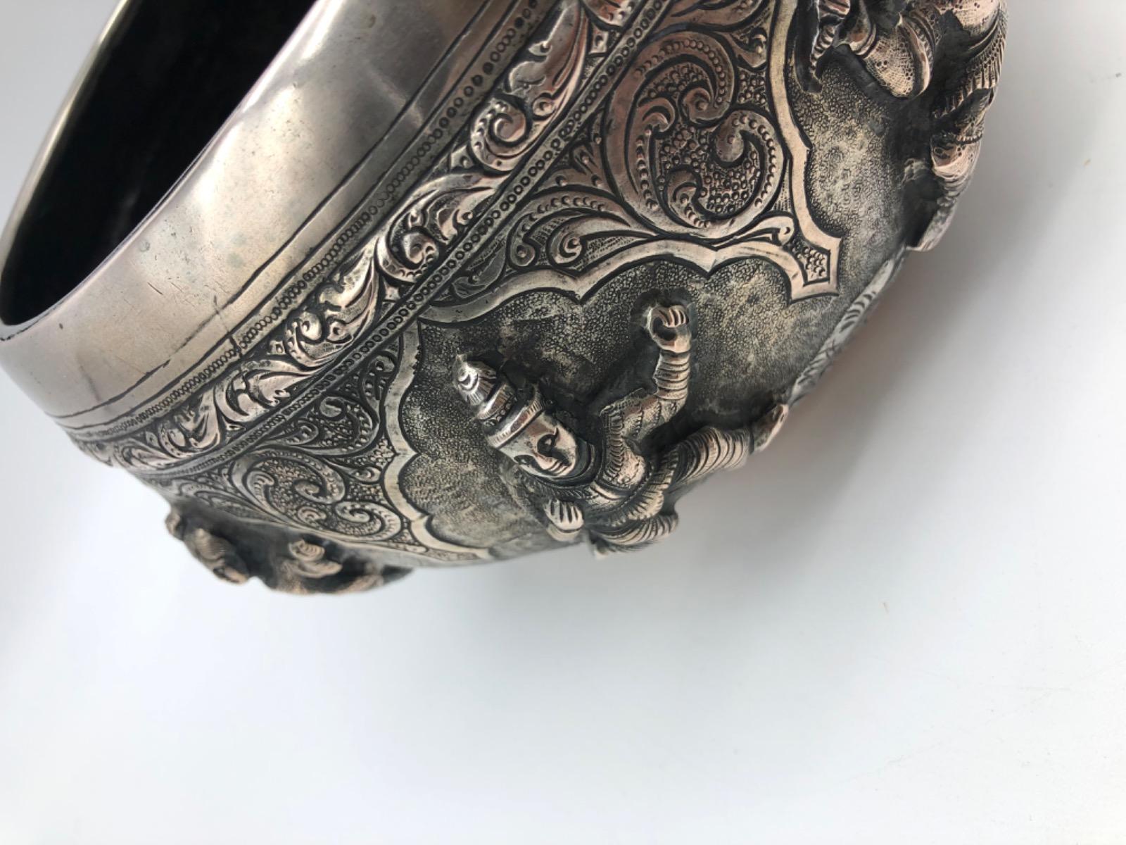 A repousse silver bowl by a peacock maker Burma ca 1900