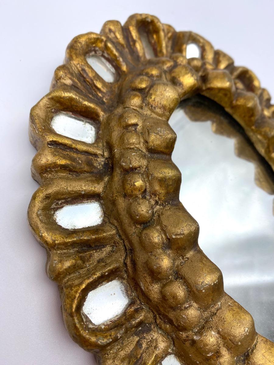 First half XX century French carved small giltwood sunburst mirror with inclusions 