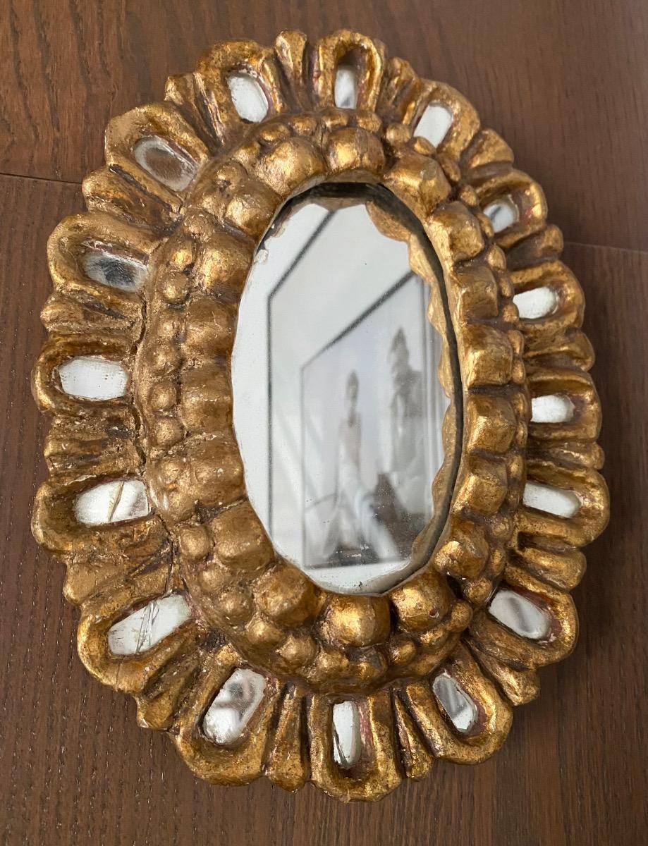 First half XX century French carved small giltwood sunburst mirror with inclusions 