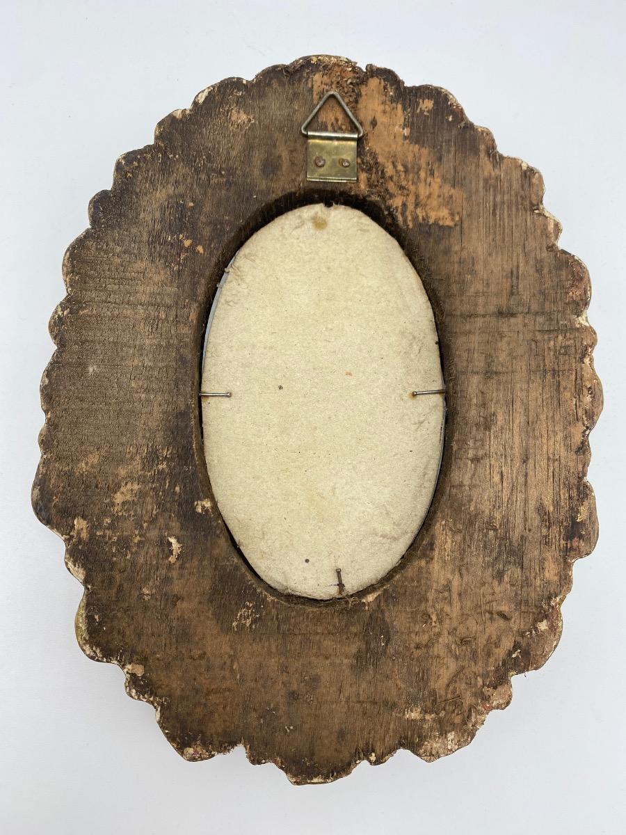 First half XX century French carved small giltwood sunburst mirror with inclusions 